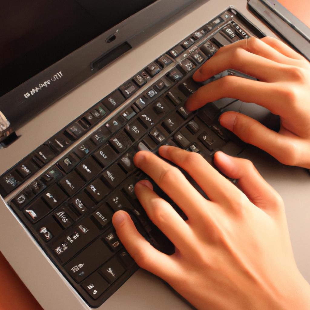 Person typing on laptop, multitasking